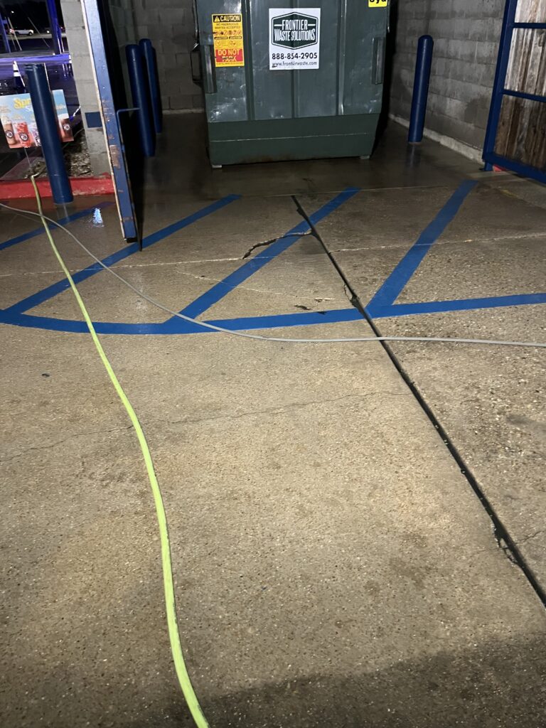 Pressure washing dirty concrete
