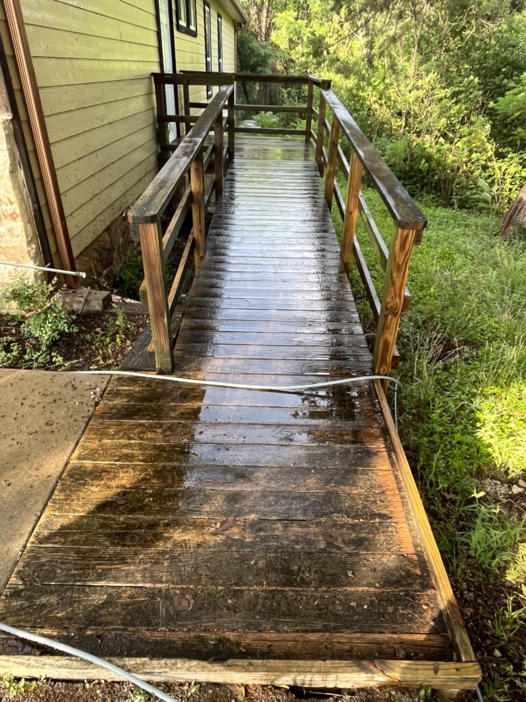 Pressure washing residential landscape